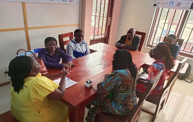 Community members meeting around a large table
